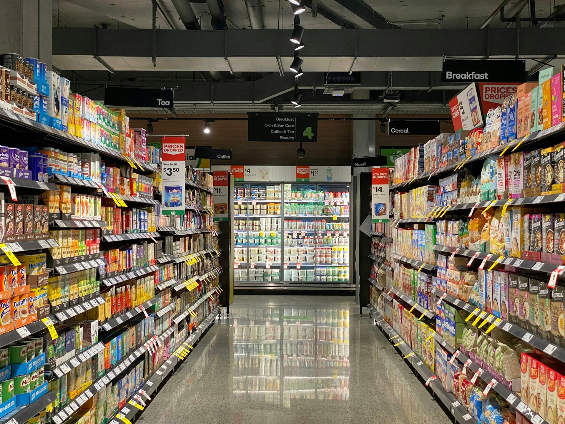 Neatly stocked grocery and snack shelves
